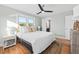 Bedroom with hardwood floors, ceiling fan and en-suite bathroom at 1894 Capri Dr, Charleston, SC 29407