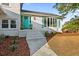 Inviting front entrance with teal door and brick facade at 1894 Capri Dr, Charleston, SC 29407