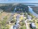 Aerial view of home's location on a waterway with neighboring houses and docks at 1894 Capri Dr, Charleston, SC 29407
