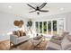 Living room features hardwood floors, bay window and ceiling fan at 1894 Capri Dr, Charleston, SC 29407