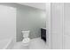Clean bathroom with a white toilet and pedestal sink at 1894 Capri Dr, Charleston, SC 29407