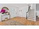Light and airy entryway with hardwood floors and stylish console table at 1894 Capri Dr, Charleston, SC 29407