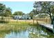 Home with a fenced backyard, wooden deck, and private dock access at 1894 Capri Dr, Charleston, SC 29407