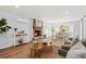 Living room with fireplace, hardwood floors, and large windows at 1894 Capri Dr, Charleston, SC 29407