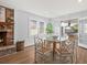 Cozy dining area with brick fireplace and hardwood floors at 1894 Capri Dr, Charleston, SC 29407