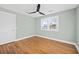 Bedroom with hardwood floors, ceiling fan and two windows at 1894 Capri Dr, Charleston, SC 29407