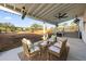 Relaxing covered patio with wicker furniture, ceiling fans, and view of backyard at 1894 Capri Dr, Charleston, SC 29407