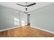Bedroom with hardwood floors, ceiling fan and access to another room at 1894 Capri Dr, Charleston, SC 29407