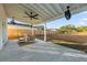 Covered patio with ceiling fans and seating area in the backyard at 1894 Capri Dr, Charleston, SC 29407