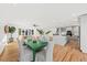 Open concept dining area with green table and hardwood floors at 1894 Capri Dr, Charleston, SC 29407