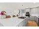 Modern kitchen with gray cabinets and large island at 1894 Capri Dr, Charleston, SC 29407
