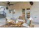 Brick patio with wicker seating area and French doors leading inside at 1894 Capri Dr, Charleston, SC 29407