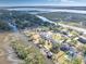 Aerial view of waterfront property, showcasing the home and surrounding neighborhood at 1894 Capri Dr, Charleston, SC 29407