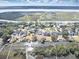Aerial view of waterfront property, showcasing the home and surrounding neighborhood at 1894 Capri Dr, Charleston, SC 29407