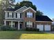 Brick two-story house with a two-car garage and well-maintained lawn at 170 Willowbend Ln, Summerville, SC 29485