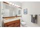 Bathroom with wood vanity, granite countertop, and large mirror at 600 Bucksley Ln # 108, Charleston, SC 29492