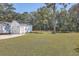 Detached garage with double doors and grassy area at 2250 Kemmerlin St, Johns Island, SC 29455