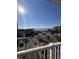 Balcony view of the ocean, parking lot, and palm trees at 106 W Arctic Avenue Ave # 3-J, Folly Beach, SC 29439