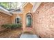 Green front door with arched entryway, brick exterior at 4294 Club Course Dr, North Charleston, SC 29420