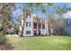 3 story home with screened porch and large backyard at 64 Warren St, Charleston, SC 29403