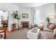 Bright living room with fireplace, hardwood floors, and comfortable seating at 8 Savage St, Charleston, SC 29401