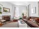 Cozy living room with fireplace, hardwood floors, and stylish furnishings at 8 Savage St, Charleston, SC 29401