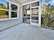 Screened porch with concrete patio and ceiling fan at 2996 Conservancy Ln, Charleston, SC 29414