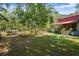 Backyard with pond and log home at 398 W Fisher Rd, Summerville, SC 29483