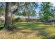 Large backyard with mature trees and a view of the house at 125 Bramwell Dr, Summerville, SC 29485