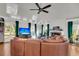 Spacious living room with hardwood floors, large windows, a fireplace, and a sectional sofa at 428 Carn St, Walterboro, SC 29488
