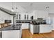 Modern kitchen with white cabinets, granite countertops, and stainless steel appliances at 428 Carn St, Walterboro, SC 29488