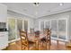 Charming dining area with wooden table and four chairs, near a window at 428 Carn St, Walterboro, SC 29488