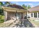 Brick patio with covered area, swing, and grill at 428 Carn St, Walterboro, SC 29488
