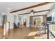Sunroom with brick accent wall, hardwood floors, and ceiling fan at 428 Carn St, Walterboro, SC 29488