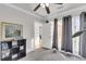 Sunlit home office with built-in shelving and backyard view at 428 Carn St, Walterboro, SC 29488