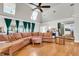 Spacious living room with hardwood floors, large windows, a fireplace, and a sectional sofa at 428 Carn St, Walterboro, SC 29488