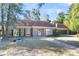 Brick home with brown roof, landscaped lawn, and a paved walkway at 428 Carn St, Walterboro, SC 29488