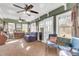Spacious sunroom with brick floors, ceiling fan, and comfortable seating at 428 Carn St, Walterboro, SC 29488
