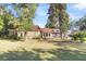 Brick house exterior with lush lawn and mature trees at 428 Carn St, Walterboro, SC 29488