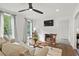 Cozy living room with hardwood floors, ceiling fan, and neutral decor at 3 Penn Ave, Charleston, SC 29407