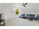 Spacious bonus room with a sectional sofa and a large window at 3 Penn Ave, Charleston, SC 29407