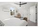 Serene attic bedroom with a wooden bed frame and window at 3 Penn Ave, Charleston, SC 29407