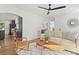 Open living room with hardwood floors, neutral decor, and view of kitchen at 3 Penn Ave, Charleston, SC 29407