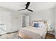 Light and airy bedroom with wood bed frame, neutral bedding, and rug at 3 Penn Ave, Charleston, SC 29407