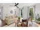 Bright living room with hardwood floors, large windows, and comfortable seating at 3 Penn Ave, Charleston, SC 29407