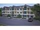 Residential building exterior with ample parking at 7636 Indigo Palms Way, Johns Island, SC 29455