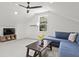 Bright bonus room with vaulted ceiling, comfortable seating, and TV at 3 Penn Ave, Charleston, SC 29407