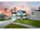 Two-story light blue house with a front yard and driveway at 718 Newbury St, Summerville, SC 29486