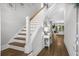 Bright entryway with hardwood floors, staircase, and console table at 2902 Clearwater Dr, Mount Pleasant, SC 29466