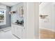 Convenient laundry room with white cabinets and hexagon tile floor at 1718 Cultivation Lane St # 536, Mount Pleasant, SC 29466